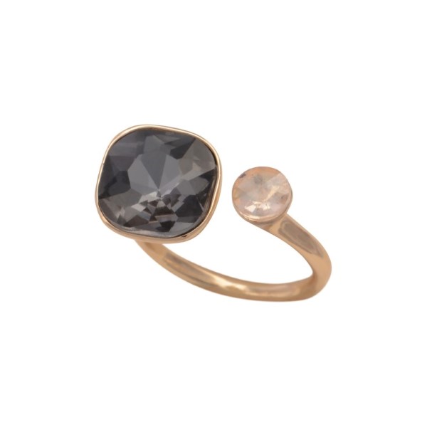 Gold tone adjustable ring with a clear and black diamond rhinestones.