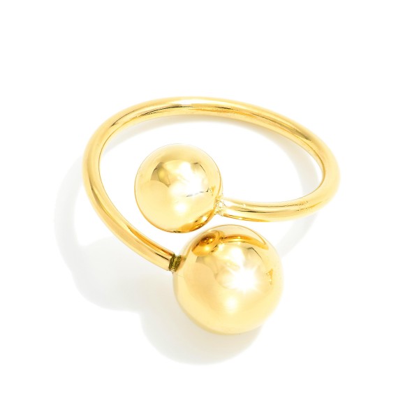 Metal Tone Wrap Ring With Ball Details 

- Water Resistant 
- Stainless Steel
- Size 7