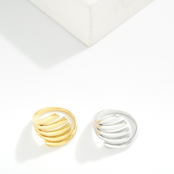 Layered Metal Wrap Ring 

- Water Resistant 
- Stainless Steel
- Size 7