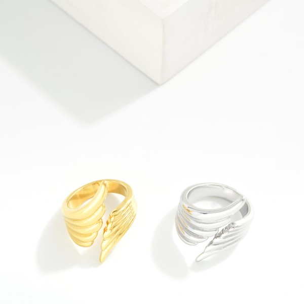 Metal Tone Feather Wrap Ring 

- Water Resistant 
- Stainless Steel
- Size 7