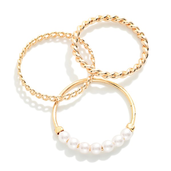 Set Of Three Stackable Rings Featuring Metal Tones & Pearls 

- Size 7-8.5 