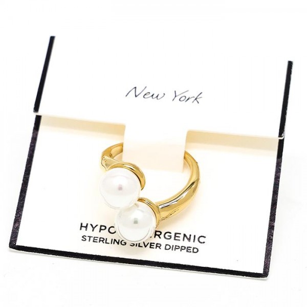 Metal Tone Wrap Ring Featuring Pearl Details 

- Stainless Steel
- Water Resistant
- Size 7.5