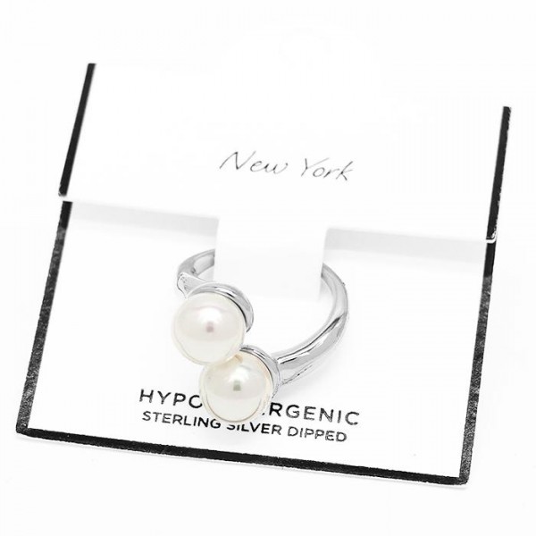 Metal Tone Wrap Ring Featuring Pearl Details 

- Stainless Steel
- Water Resistant
- Size 7.5