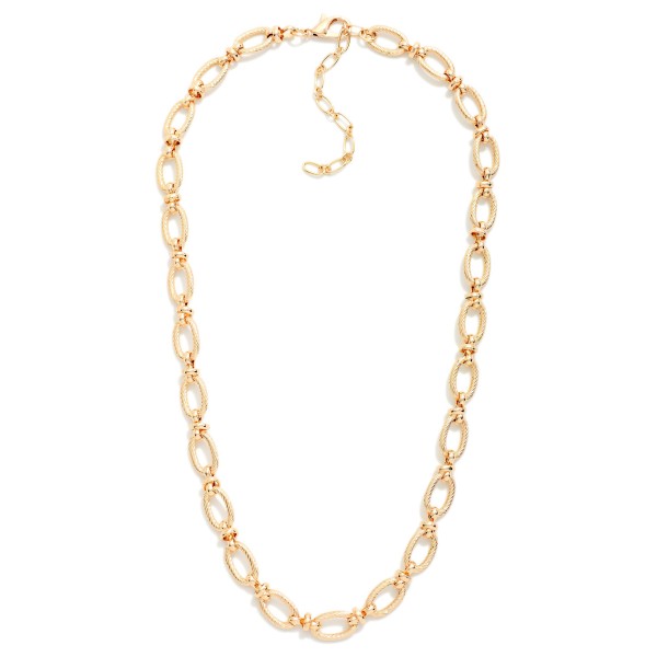 Oval Link Chain Necklace featuring polished, elongated links in a classic everyday length. Bold enough to wear alone and easy to layer with pendants and dainty chains. Finished with a lobster clasp and extender chain for an adjustable fit. A wardrobe staple that pairs with tees, sweaters, and dresses and sells consistently across all ages.