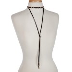 Black cord layered choker necklace with gold tone hardware. Approximately 14" in length.