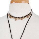 Black cord double layer choker necklace with gold tone charms. Approximately 32" in length.