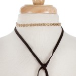 Black suede and gold tone wrap necklace set. Approximately 80" in length. 