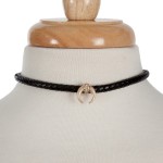 Black braided leather cord choker necklace with a crescent pendant. Approximately 13" in length