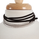 Black suede wrap necklace with a silver tone choker. Approximately 70" in length. 