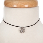 Black waxed cord choker with a silver tone script 'W' initial. Approximately 12" in length. 