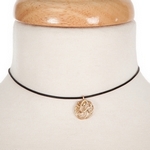 Black waxed cord choker with a gold tone script 'G' initial. Approximately 12" in length. 