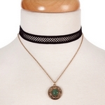 Black and gold tone, double layer choker with a circle pendant, accented by a green stone. Approximately 12" in length.