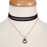 Black and gold tone, double layer choker with a blue stone pendant. Approximately 12" in length. 