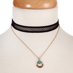 Black and gold tone, double layer choker with a turquoise stone pendant. Approximately 12" in length. 