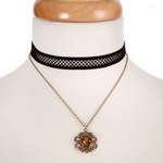 Black and gold tone, double layer choker with a flower pendant, accented by a brown stone. Approximately 12" in length. 