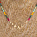 Wholesale iridescent beaded necklace gold star center accents