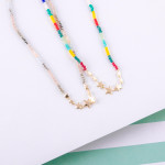 Wholesale iridescent beaded necklace gold star center accents