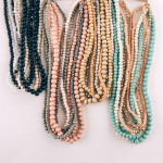 Wholesale layered necklace wood iridescent beaded details