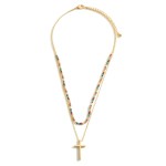 Layered Gold Necklace Featuring a Cross Pendant and Beaded Accents.

- Approximately 7.5" in Length
- Extender Approximately 3" in Length