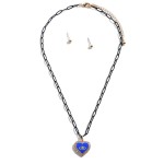 Colored Chain Link Necklace Featuring Evil Eye Heart Pendant With Rhinestone Accents and Gold Stud Earrings

- Approximately 16" Length
- 3" Extender