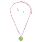 Colored Chain Link Necklace Featuring Evil Eye Heart Pendant With Rhinestone Accents and Gold Stud Earrings

- Approximately 16" Length
- 3" Extender