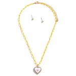 Colored Chain Link Necklace Featuring Evil Eye Heart Pendant With Rhinestone Accents and Gold Stud Earrings

- Approximately 16" Length
- 3" Extender