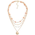 Layered Chain Link Necklace Featuring Pitted Metal Charm With Daisy and Pearl Details

- Approximately 16" L
- Extender 3" L