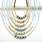 Beaded Necklace Featuring Stone Beads 

- Approximately 14" L
- Extender 3" L