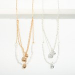 Chain Link Necklace Featuring Layered Detailing With Pearl Beads and Geometric Pendants

- Approximately 16" L
- Extender 3" L