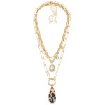 Layered Metal Chain Link Necklace With Rhinestone and Acetate Teardrop Pendants

- Approximately 24" L
- Extender 3" L