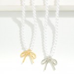 Pearl Bead Necklace Featuring Bow Pendant 

- Approximately 16" L
- Extender 2" L