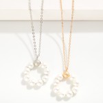 Simple Chain Link Necklace Featuring Pearl Beaded Circle Pendant

- Approximately 18" L
- Extender 3" L