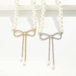 Pearl Beaded Necklace Featuring Rhinestone Studded Bow Pendant 

- Approximately 14" L
- Extender 3" L