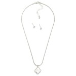 Metal Tone Snake Chain Necklace Featuring Pearlescent Clover Pendant 

- Included - Metal Tone Ball Stud Earrings 
- Approximately 14" L 
- Extender 2" L