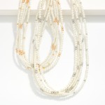 Layered Pearl Beaded Necklace Featuring Metal Tones 

- Approximately 16" L
- Extender 3" L