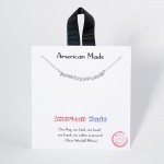 Dainty Chain Link Necklace Featuring Metal Tone "American Made" Pendant 		
					
- Approximately 16" L					
- Extender 2" L					
- Made in Korea					
- Hypoallergenic Brass Base					
- 18K Gold Dipped					
- Card: "One flag, one land, one heart, one hand, one nation evermore!" - Oliver Wendell Holmes 