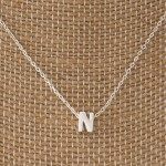 Dainty necklace with initial charm. Approximately 16" in length with a 1/4" letter charm. 