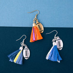 Wholesale raffia tassel drop earrings silver metal football accent