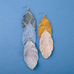 Wholesale metallic faux leather snakeskin feather earrings