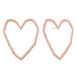 Oversized hammered heart stud earrings.

- Approximately 1.5" L