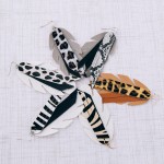 Wholesale faux leather zebra print feather tassel statement earrings