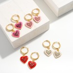 Gold Tone Huggie Hoop Earrings Featuring Enamel and Rhinestone Heart Charms

- Approximately 1.25" Long