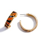 Gold Tone Animal Print Enameled Hoop Earring

- Approximately 1" Diameter