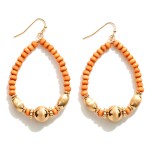 Wood Beaded Teardrop Earrings With Gold Accents

- Approximately 2.5" L