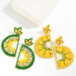 Seed Bead and Rhinestone Lime Slice Drop Earrings

- Approximately 3" L