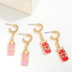 Huggie Hoop Earrings Featuring Enamel Heart Champagne Bottle Charms

- Approximately 1.75" L