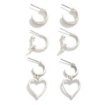 Set of Three Metal Hoop Earrings Featuring Heart Charms

- Approximately .5" - 1" L