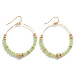 Beaded Wire Hoop Drop Earrings Featuring Gold Tone Bead Accents.

- Approximately 2" L