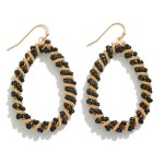 Teardrop Earring Featuring Intertwined Coil Spring and Glass Beads

- Approximately 2" L