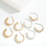 Metal Hoop Earring With Tapered Beaded Details

- Approximately  0.75" L